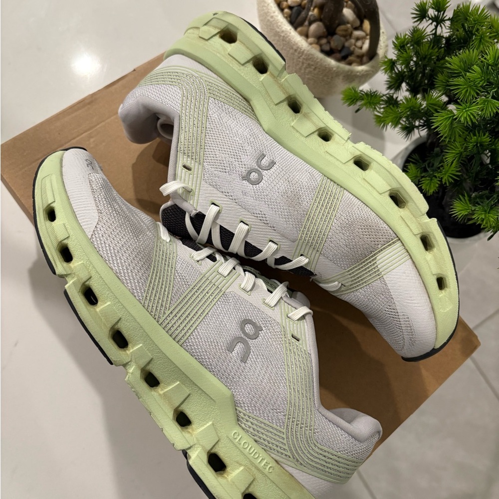 On Running White and Light Green Cloud Sneakers